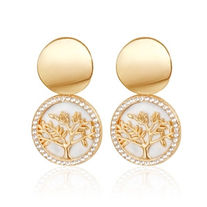 Detail of gold tree of life drop earrings with white shell inlay and sparkling crystals