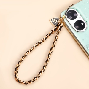 Catena per cellulare intrecciata a mano con maglie dorate, velluto nero e ciondolo a cuore