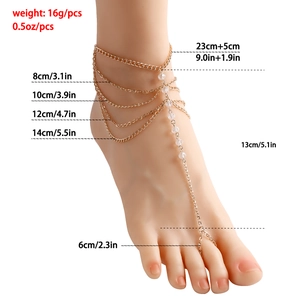 Multilayer gold foot chain with crystal fringe and toe ring for women on white background
