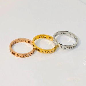 Roman numeral hollow ring set in gold, silver, and rose gold with clear crystals