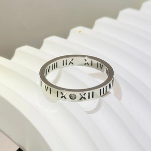 Silver stainless steel ring featuring Roman numeral engravings and a central zircon stone
