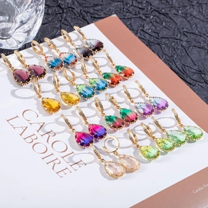 Macro shot of colorful pear-shaped drop earrings with micro-pave crystal settings