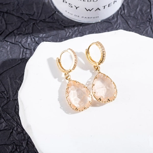 Detail of pear-cut pink tourmaline earrings with micro-paved zircon stones
