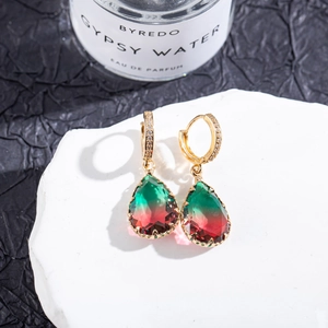Macro detail of pear-cut tourmaline earrings with pavé setting and gradient color