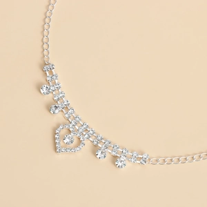 Cadena de pierna elástica con corazón de pedrería y borlas plateadas brillantes