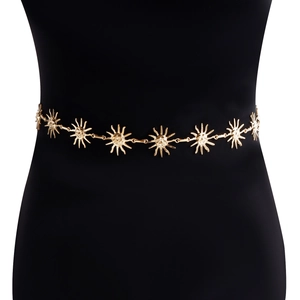 Detailed macro view of the sun face charms on a gold metallic vintage chain belt