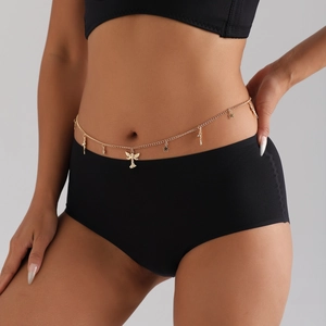 Golden waist chain with angel and star charms worn by a model over black clothing