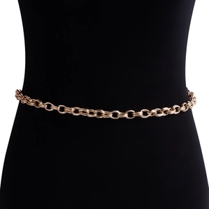 Detail of gold chunky waist chain with spiral textured metal rings on black mannequin