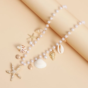 Détails de la chaîne de taille bohème avec étoile de mer dorée et perles artificielles