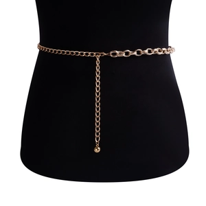 Detailed view of bold gold chunky chain waist belt on mannequin with metal ball drop