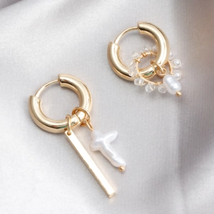 Asymmetric gold earrings with geometric bar, pearl cross and crystal bead hoop