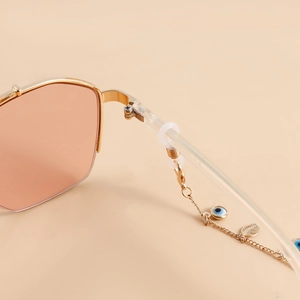 Chaîne de lunettes dorée avec œil protecteur et feuilles avec lunettes roses pour femme