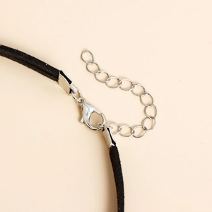 Close-up of the silver lobster clasp and adjustable extension chain on the black neck choker
