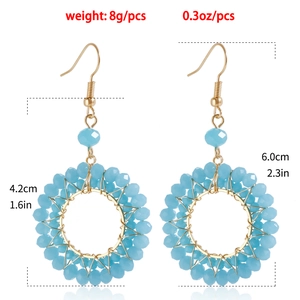 Detailed view showing dimensions and weight of light blue beaded hoop earrings