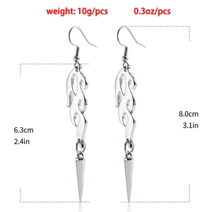 Detailed size view of silver gothic long tassel flame earrings with rivet spike pendants