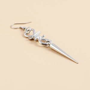Gothic silver punk earring detail featuring a twisted knot and long cone spike pendant