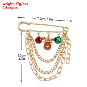 Detailansicht der goldenen Weihnachts-Brosche mit Rentier-Anhänger und Glocken an Ketten
