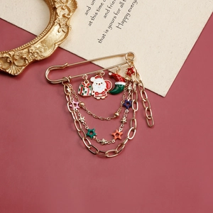 Festive Christmas brooch featuring Santa pendants and multi-layer gold chains with star charms
