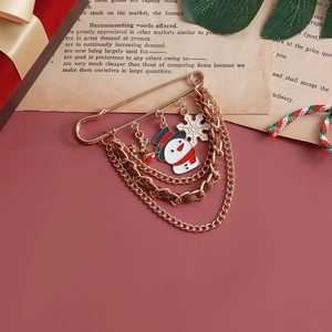 Christmas snowman and snowflake safety pin brooch with festive layered chain decoration