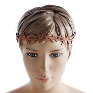 Detailed close-up of brown thorn crown headpiece on a mannequin head for Halloween style