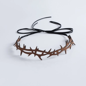 Detailed view of dark brown thorn crown with black satin ribbons for gothic cosplay
