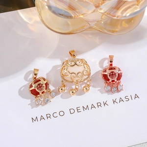 Detailed view of Chinese Ruyi lock pendants with cat eye stones on a display card