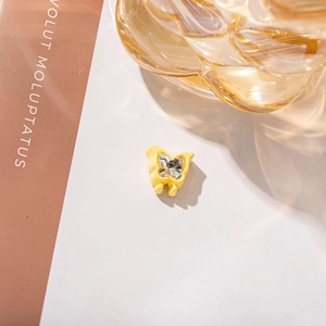 Fashionable lemon yellow butterfly accessory with sparkling crystal center in a stylish design