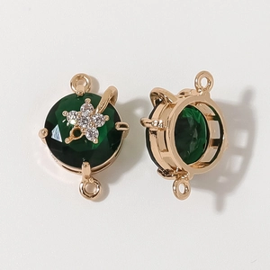 Detailed macro view of gold plated green gemstone jewelry connector for DIY necklaces
