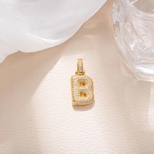 Iced out gold plated letter B pendant with micro paved cubic zirconia stones