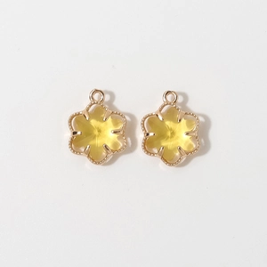 Close-up of 12mm gold-plated six-leaf flower pendants for DIY jewelry making