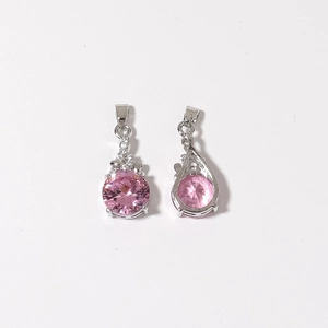 Pink dreamcatcher pendant with micro-set zircon and tassel detail on white background