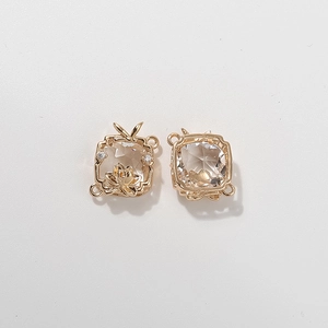 Golden square lotus scarf buckle with clear faceted stone and rabbit ear detail