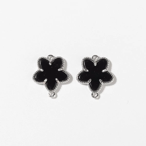 Pair of black enamel flower pendants with silver beaded edges and dual jump rings