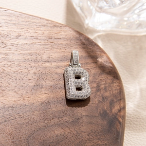 Close-up of silver letter B pendant with micro-pave zircons for hip hop style necklace