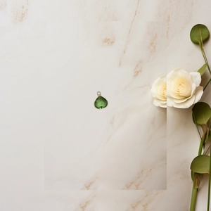 Macro shot of a heart-shaped green crystal pendant on an elegant marble background