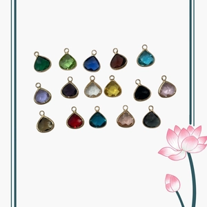 Set of 17 colorful heart and teardrop gemstone pendants with golden metal frames