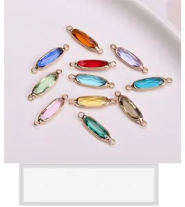 Detailed view of multi-color faceted crystal charms with gold-plated edges for DIY jewelry