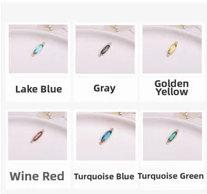Macro detail of six colorful oval crystal charms with gold plating for jewelry making