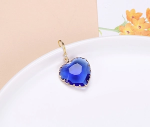 Exquisite faceted blue crystal heart pendant with gold plating and zircon accent detail
