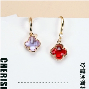 Detail shot of four-leaf clover crystal charms in gold plating for DIY jewelry crafting
