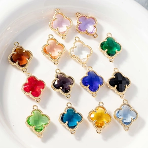Colorful four-leaf clover crystal connectors with gold milgrain edges for jewelry making