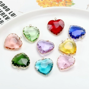 Transparent heart-shaped crystal pendants with gold metal edges in nine assorted colors