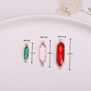 Gold-plated oval crystal charms in emerald, pink and red for DIY jewelry making