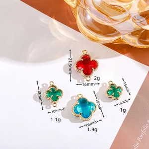 Colorful crystal clover pendants with gold metal edges in assorted sizes and shades