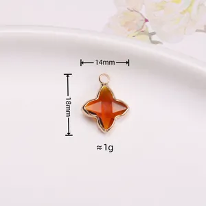 Pendentif étoile à quatre branches en cristal orange avec bord doré de 14x18 mm