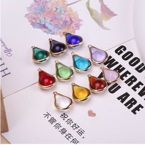 Close-up of colorful teardrop gourd pendants with gold-plated edges in eleven vibrant colors