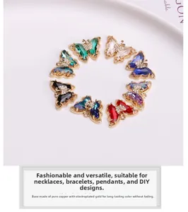 Macro shot of colorful crystal butterfly charms with gold-plated copper base for jewelry