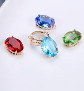 Macro detail of faceted oval crystal pendants in gold plated copper for DIY jewelry making