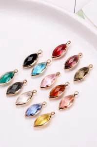 Macro shot of colorful marquise crystal charms with gold-plated copper edges for DIY jewelry