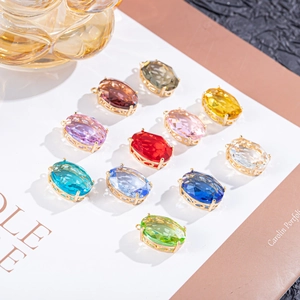 Oval crystal charms with gold-plated copper base in assorted vibrant colors for DIY jewelry